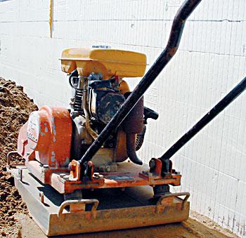 
A walk-behind earth compactor ensures that poured concrete floors won't crack due to settling of the underlying fill.
